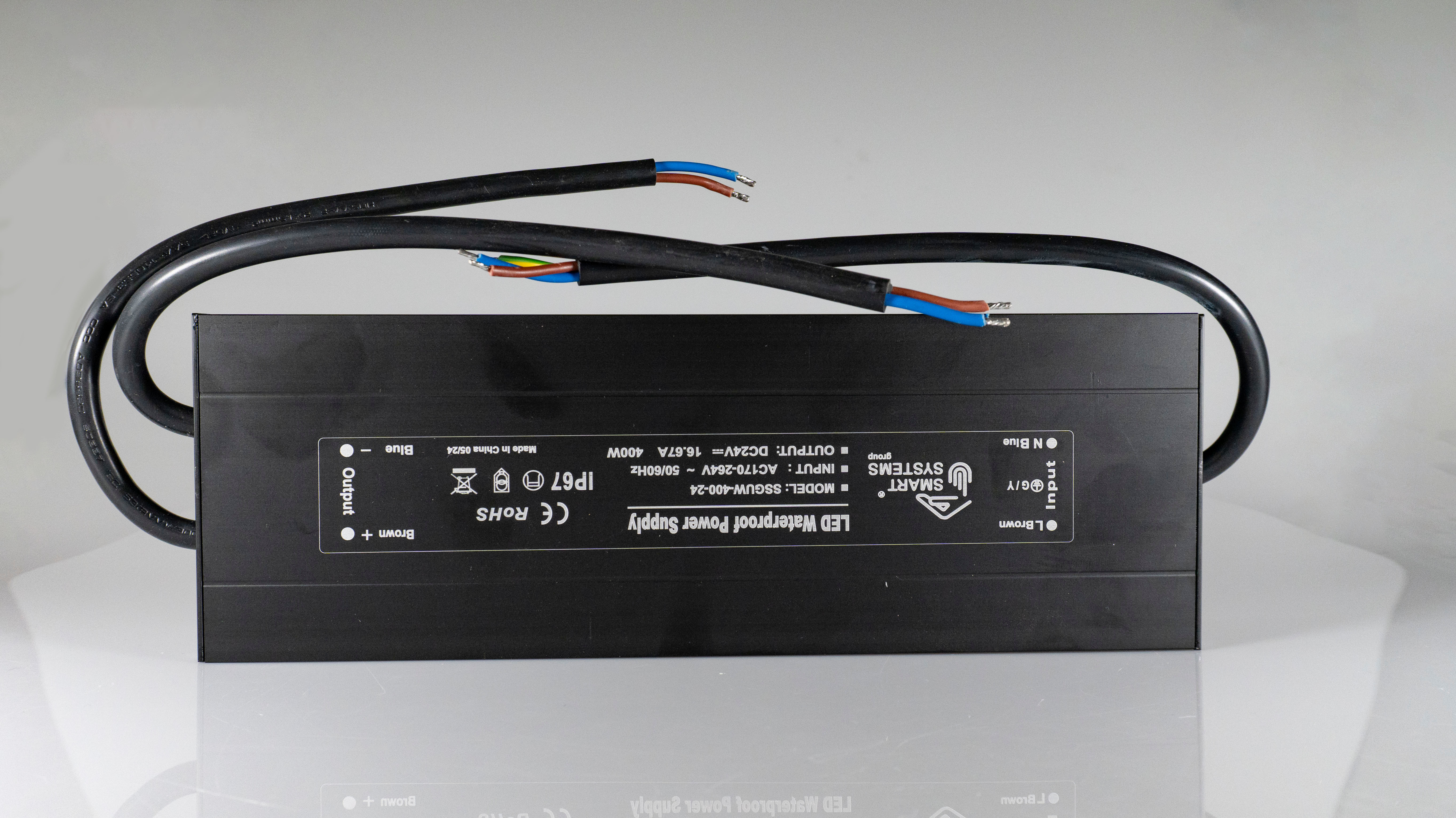 Power supply unit from Smart Systems Group, 400 W, 24V, IP67, featuring two wires and a compact black box design